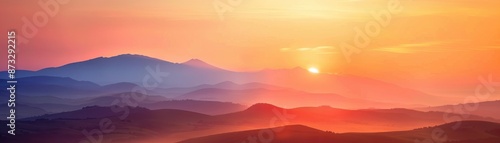 Stunning panoramic sunrise over serene mountain range with vibrant hues of orange, pink, and blue sky, creating a breathtaking natural landscape.