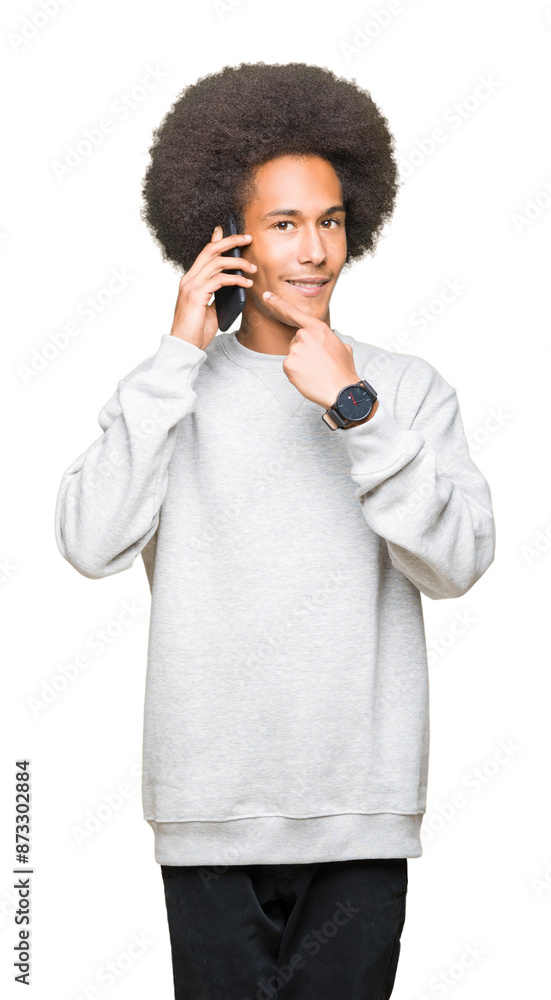 Young african american man with afro hair talking on smartphone very happy pointing with hand and finger Young african american man with afro hair talking on smartphone very happy pointing with hand and finger