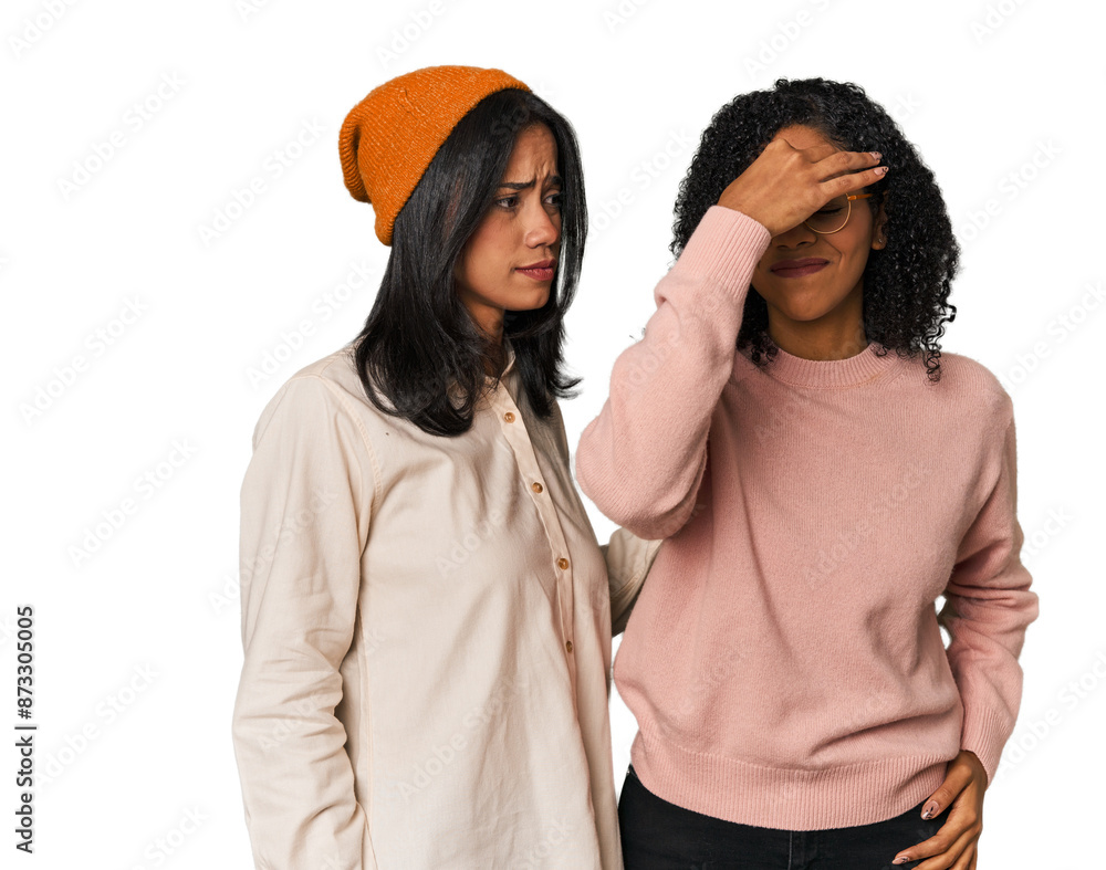 Young Latin friends together in studio having a head ache, touching front of the face. Young Latin friends together in studio having a head ache, touching front of the face.