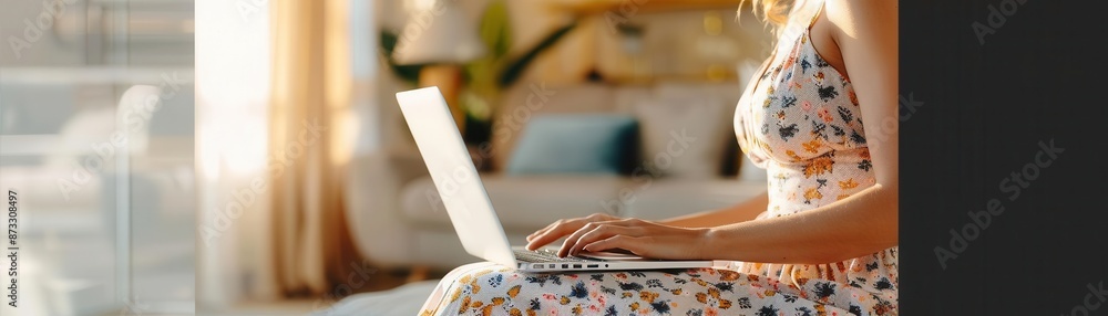 Fototapeta premium Sunlit office, chic woman in elegant dress typing on laptop, cozy living room backdrop, mid-century modern decor, soft morning light, slight high angle