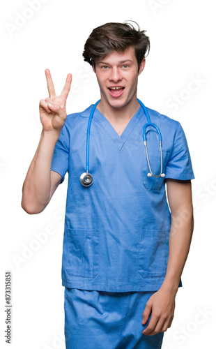 Young doctor wearing medical uniform over isolated background showing and pointing up with fingers number two while smiling confident and happy.