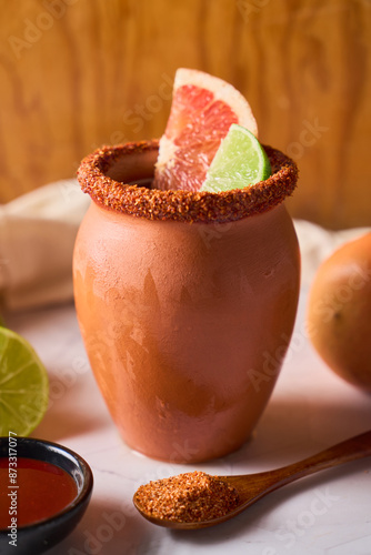 Refreshing Cantarito Drink in Authentic Clay Cup, from mexico photo