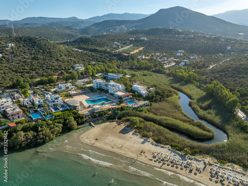 Greece - Crete - The famous Almyros beach is one of the most beautiful sandy beaches in Crete, with a small stream flowing into the sea nearby. The town of Agios Nikolaos is nearby photo