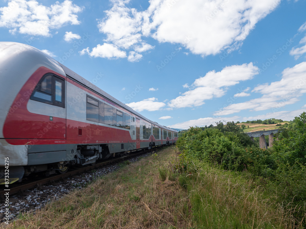 Traveling by train through the longest railway viaduct built in an arch above the town of Hanušovce nad Topľou.Traveling by train in Slovakia. Traveling by train through the longest railway viaduct built in an arch above the town of Hanušovce nad Topľou.Traveling by train in Slovakia.