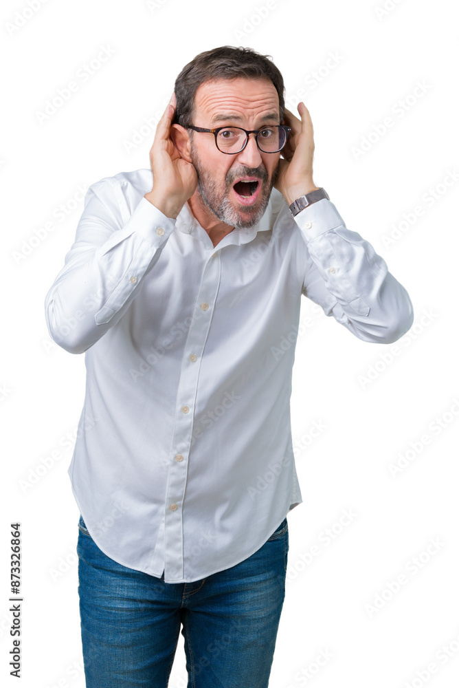 Handsome middle age elegant senior business man wearing glasses over isolated background Trying to hear both hands on ear gesture, curious for gossip. Hearing problem, deaf Handsome middle age elegant senior business man wearing glasses over isolated background Trying to hear both hands on ear gesture, curious for gossip. Hearing problem, deaf