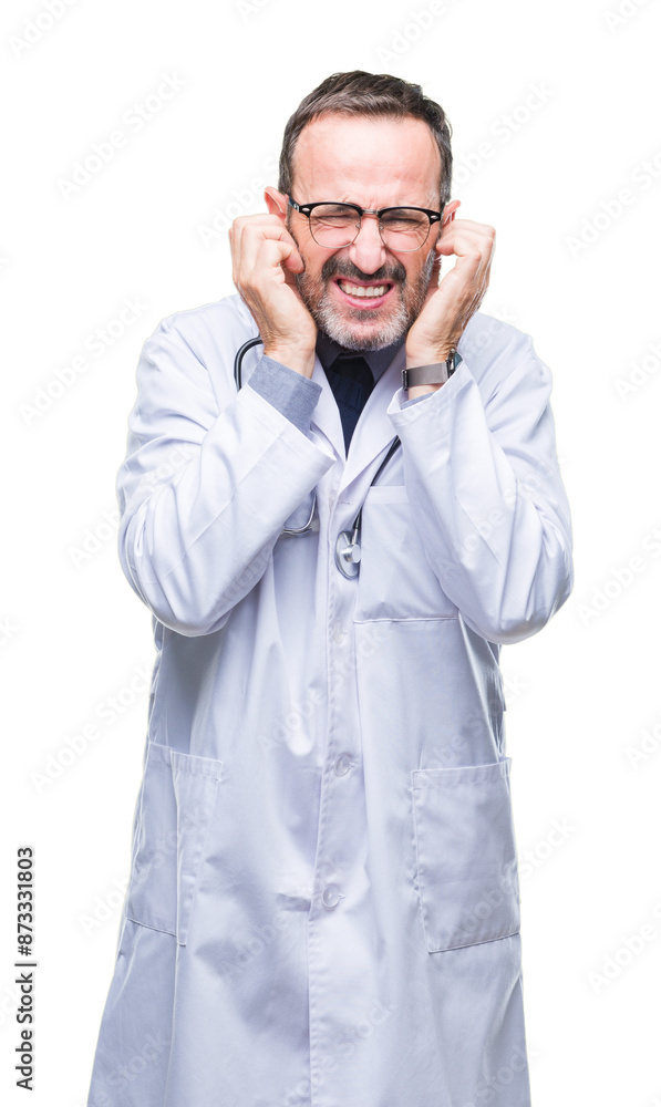 Middle age senior hoary doctor man wearing medical uniform isolated background covering ears with fingers with annoyed expression for the noise of loud music. Deaf concept. Middle age senior hoary doctor man wearing medical uniform isolated background covering ears with fingers with annoyed expression for the noise of loud music. Deaf concept.