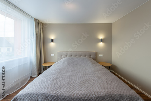 Minimalism Bedroom Interior. Wardrobe in Background. Coffee Table and Light. Windows and Curtains. Home.