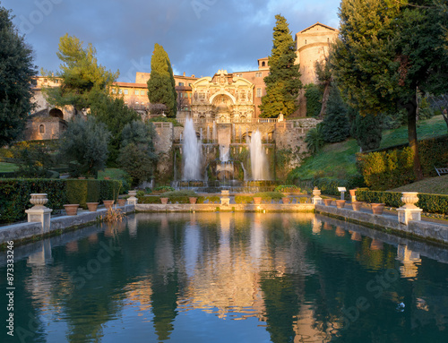 Villa d'Este, Tivoli, Italy. The Fountain of Neptune and The Fountain of the Organ with its Castellum aqua, or water castle across the fish ponds photo