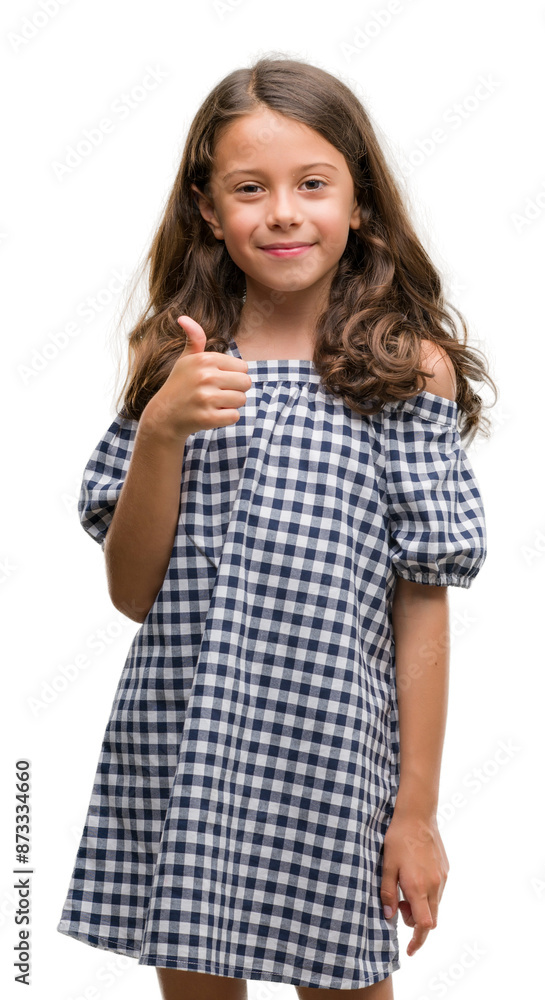 Brunette hispanic girl wearing black and white dress happy with big smile doing ok sign, thumb up with fingers, excellent sign Brunette hispanic girl wearing black and white dress happy with big smile doing ok sign, thumb up with fingers, excellent sign