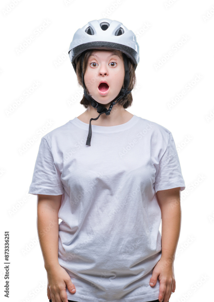 Young adult cyclist woman with down syndrome wearing safety helmet over isolated background afraid and shocked with surprise expression, fear and excited face. Young adult cyclist woman with down syndrome wearing safety helmet over isolated background afraid and shocked with surprise expression, fear and excited face.