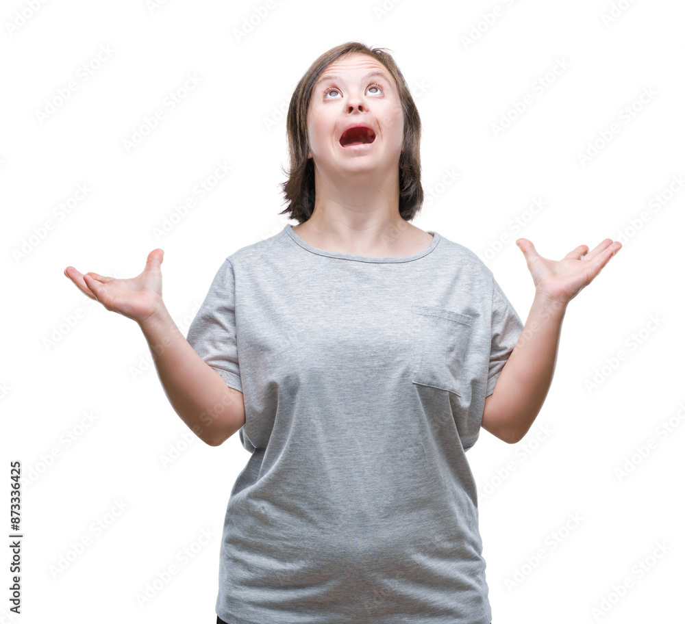 Young adult woman with down syndrome over isolated background celebrating crazy and amazed for success with arms raised and open eyes screaming excited. Winner concept Young adult woman with down syndrome over isolated background celebrating crazy and amazed for success with arms raised and open eyes screaming excited. Winner concept
