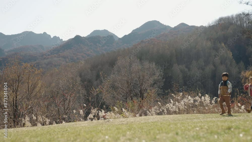 Happy young family hiking outdoors Happy young family hiking outdoors
