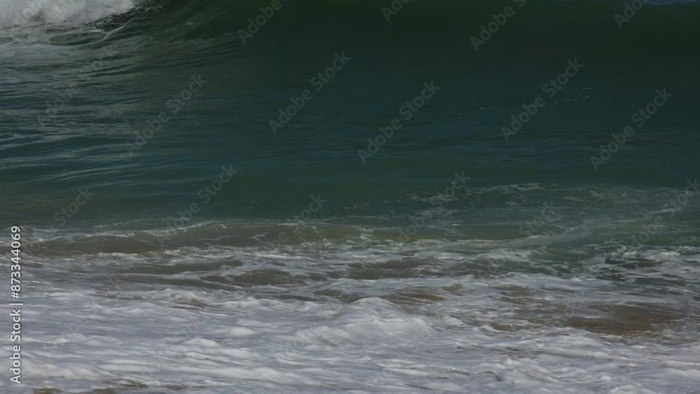 Closeup of foamy waves on the samdy beach in Phuket, Thailand Closeup of foamy waves on the samdy beach in Phuket, Thailand