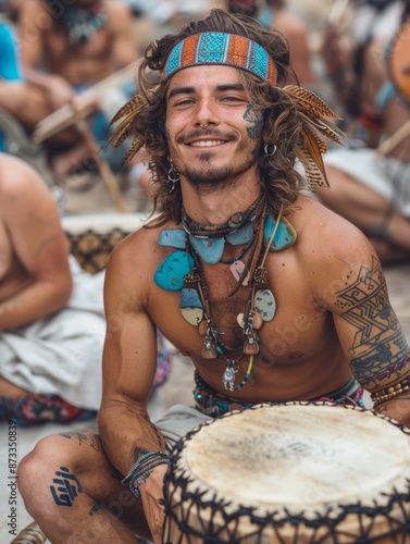 A person with a drum, wearing a headband and necklaces, at a music festival photo