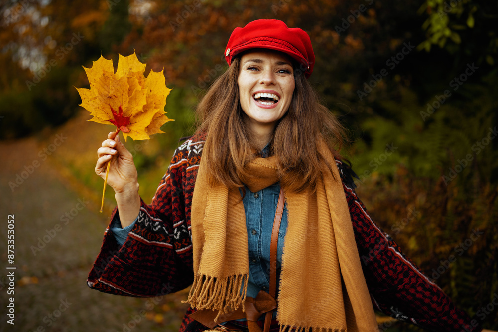 Portrait of happy stylish woman in jeans shirt and hat walking Portrait of happy stylish woman in jeans shirt and hat walking