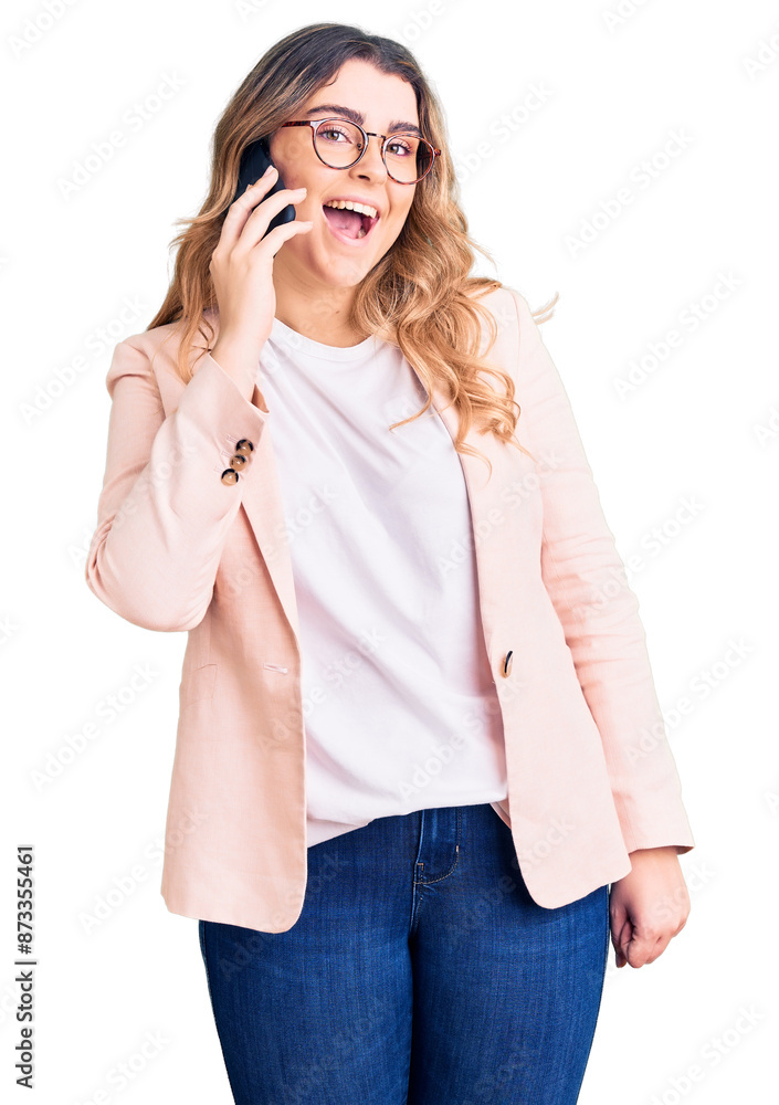 Young caucasian woman having conversation talking on the smartphone looking positive and happy standing and smiling with a confident smile showing teeth Young caucasian woman having conversation talking on the smartphone looking positive and happy standing and smiling with a confident smile showing teeth