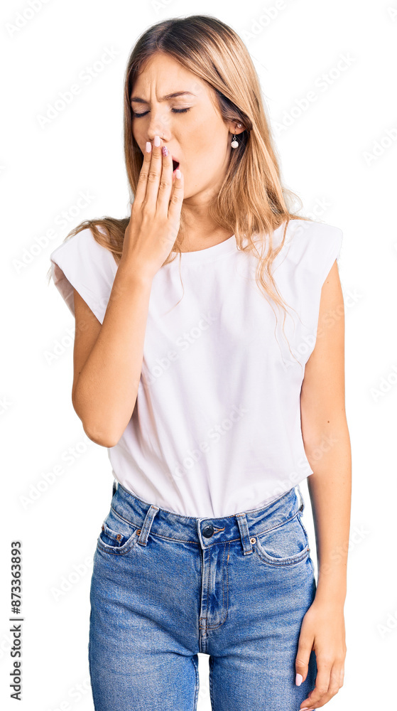 Beautiful caucasian woman with blonde hair wearing casual white tshirt bored yawning tired covering mouth with hand. restless and sleepiness. Beautiful caucasian woman with blonde hair wearing casual white tshirt bored yawning tired covering mouth with hand. restless and sleepiness.