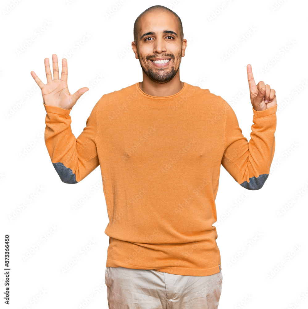 Naklejka premium Hispanic adult man wearing casual winter sweater showing and pointing up with fingers number six while smiling confident and happy.