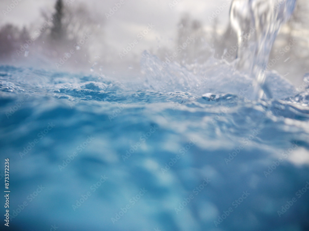 Obraz premium A body of water with a splash of water in the foreground. stockphoto.