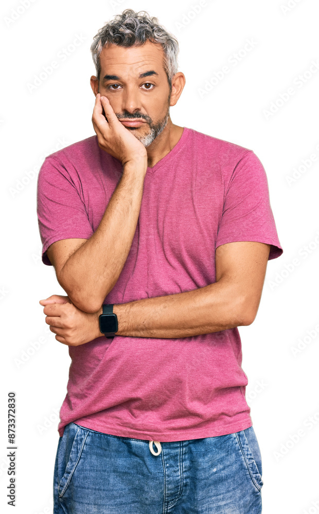 Middle age grey-haired man wearing casual clothes thinking looking tired and bored with depression problems with crossed arms. Middle age grey-haired man wearing casual clothes thinking looking tired and bored with depression problems with crossed arms.