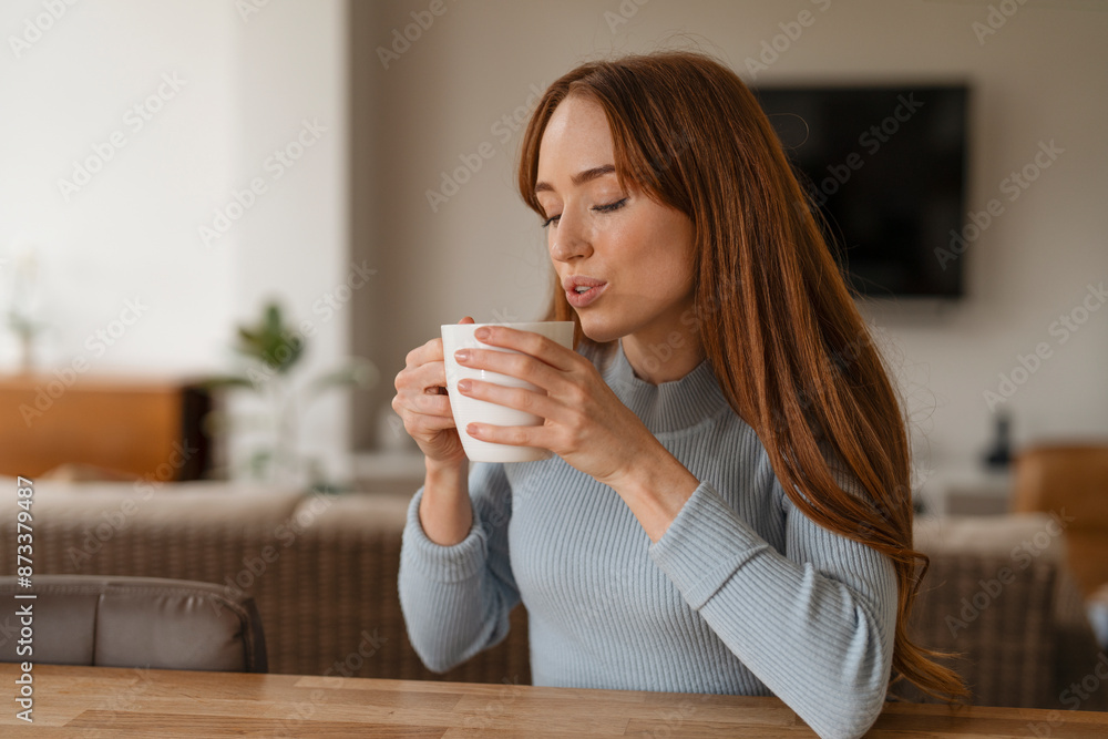 Woman Drinking Coffee In Her Living Room During Day Woman Drinking Coffee In Her Living Room During Day