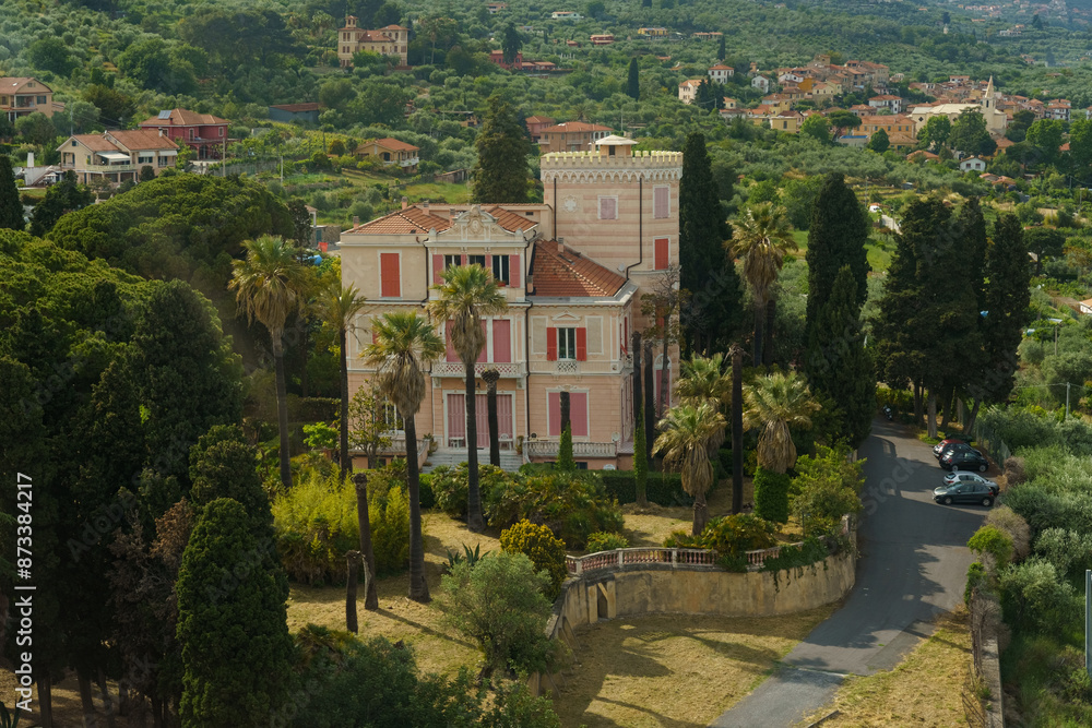 Aerial View of a Pink Villa With Palm Trees in a Hillside Italian Town Aerial View of a Pink Villa With Palm Trees in a Hillside Italian Town