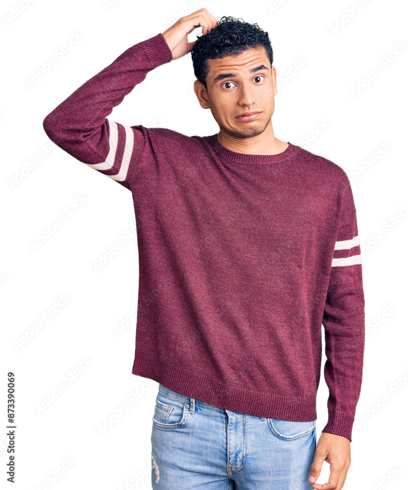 Hispanic handsome young man wearing casual clothes confuse and wonder about question. uncertain with doubt, thinking with hand on head. pensive concept. Hispanic handsome young man wearing casual clothes confuse and wonder about question. uncertain with doubt, thinking with hand on head. pensive concept.
