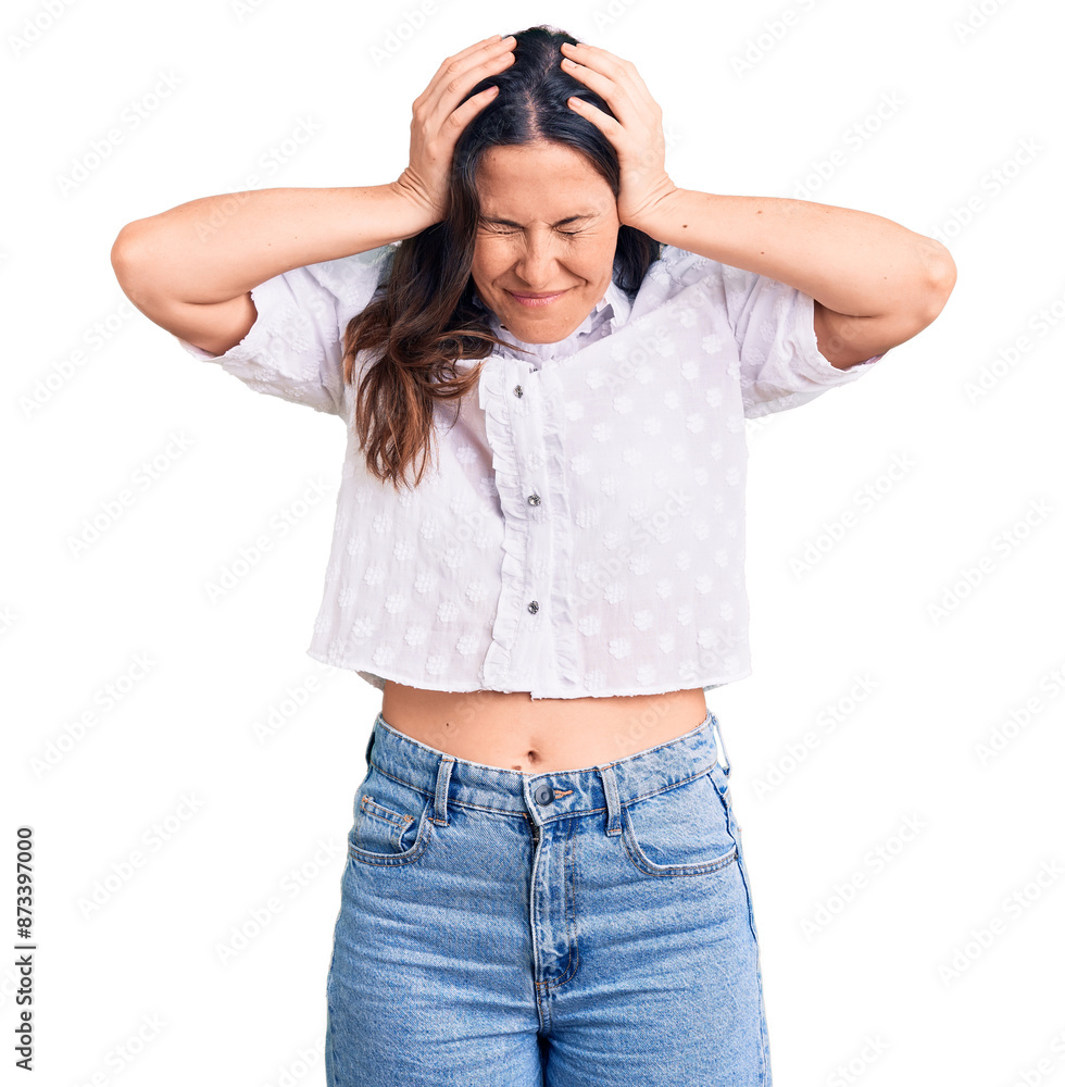 Young beautiful brunette woman wearing casual shirt suffering from headache desperate and stressed because pain and migraine. hands on head. Young beautiful brunette woman wearing casual shirt suffering from headache desperate and stressed because pain and migraine. hands on head.