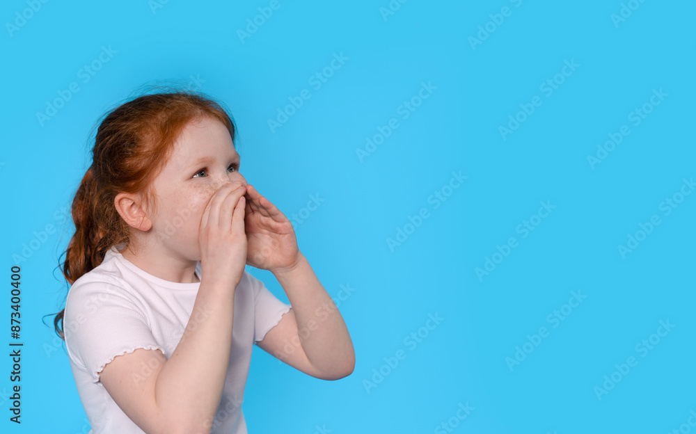 Young Girl With Red Hair Shouting Against Blue Background Young Girl With Red Hair Shouting Against Blue Background