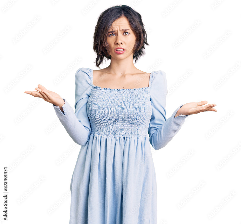 Young beautiful girl wearing casual clothes clueless and confused with open arms, no idea concept. Young beautiful girl wearing casual clothes clueless and confused with open arms, no idea concept.