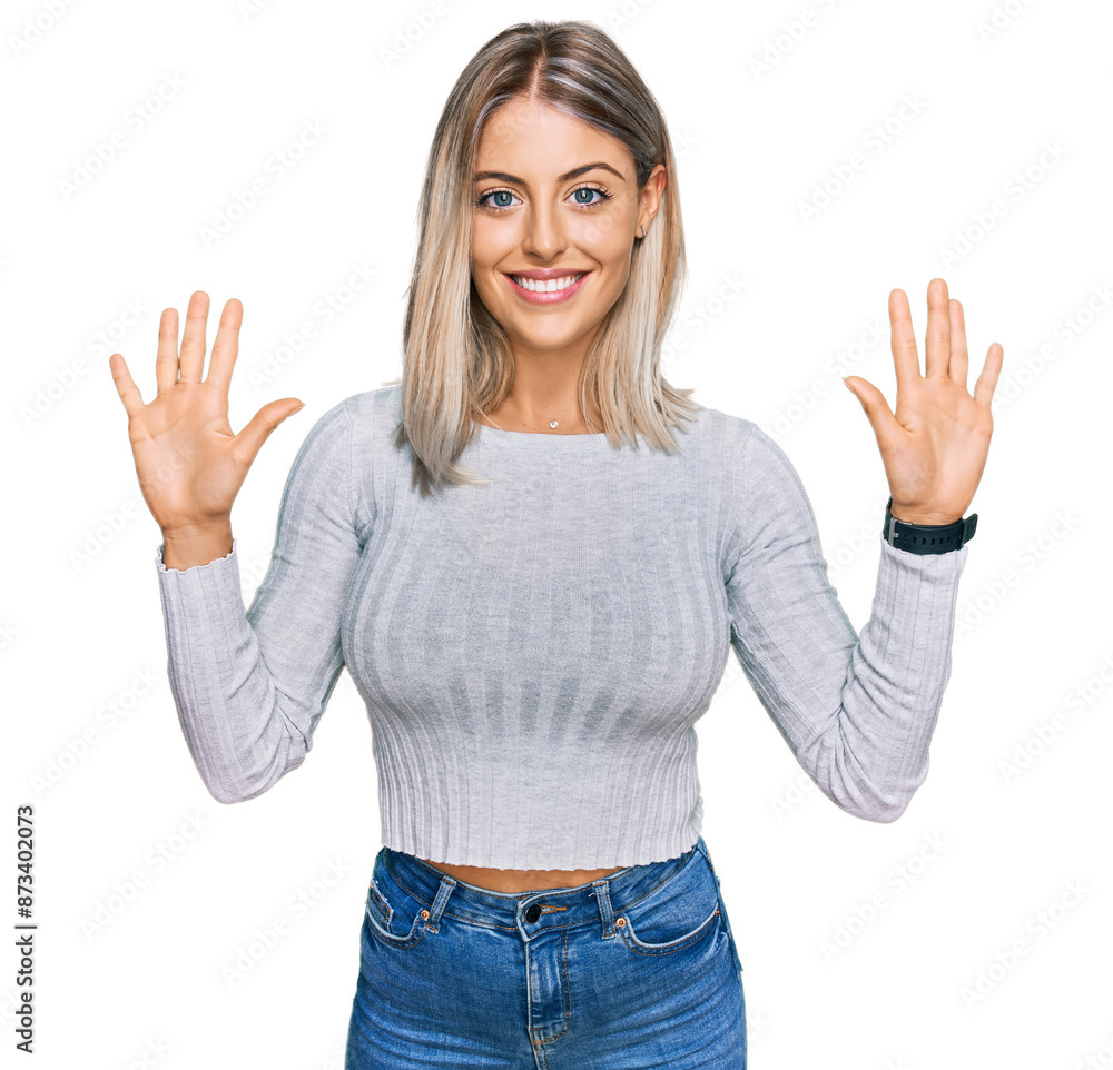 Beautiful blonde woman wearing casual clothes showing and pointing up with fingers number ten while smiling confident and happy. Beautiful blonde woman wearing casual clothes showing and pointing up with fingers number ten while smiling confident and happy.