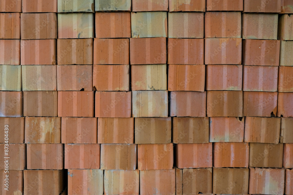 photo of red bricks stacked on top of each other photo of red bricks stacked on top of each other