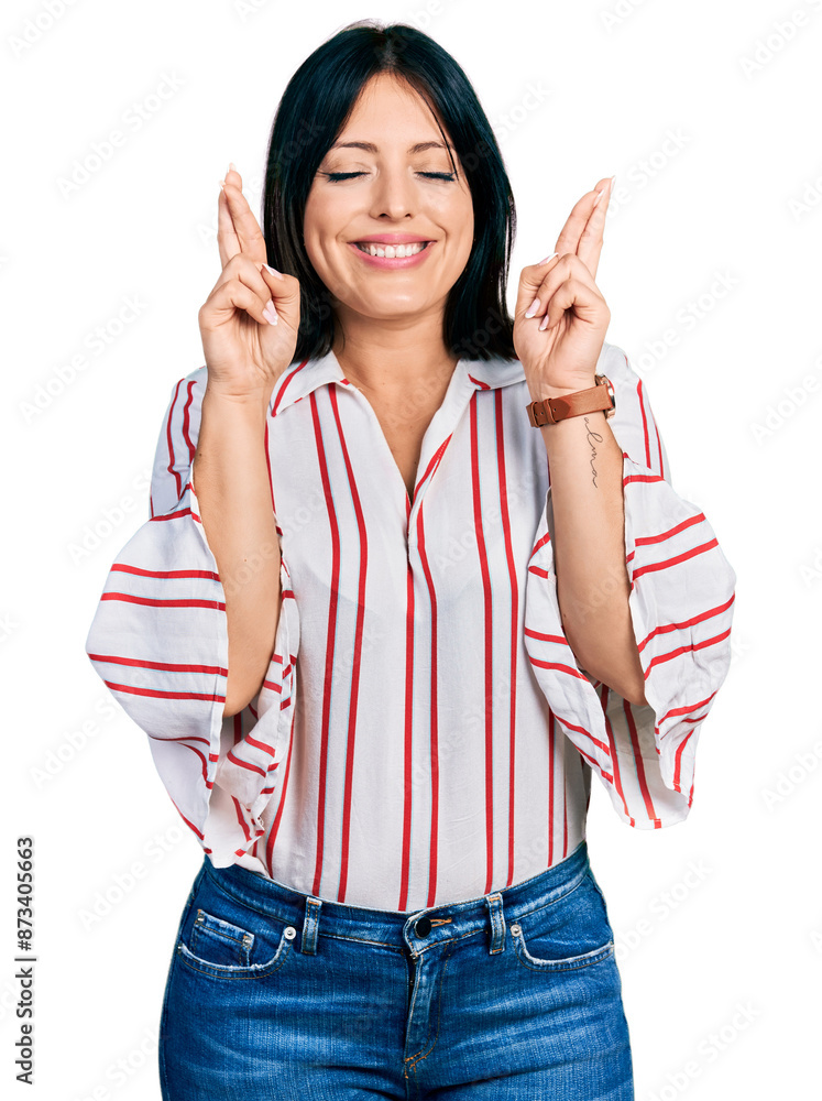 Young hispanic girl wearing casual clothes gesturing finger crossed smiling with hope and eyes closed. luck and superstitious concept. Young hispanic girl wearing casual clothes gesturing finger crossed smiling with hope and eyes closed. luck and superstitious concept.