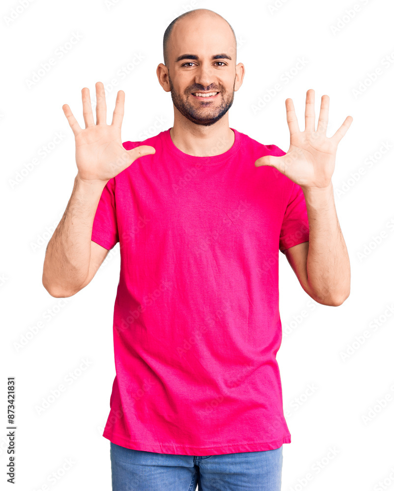 Young handsome man wearing casual t shirt showing and pointing up with fingers number ten while smiling confident and happy. Young handsome man wearing casual t shirt showing and pointing up with fingers number ten while smiling confident and happy.