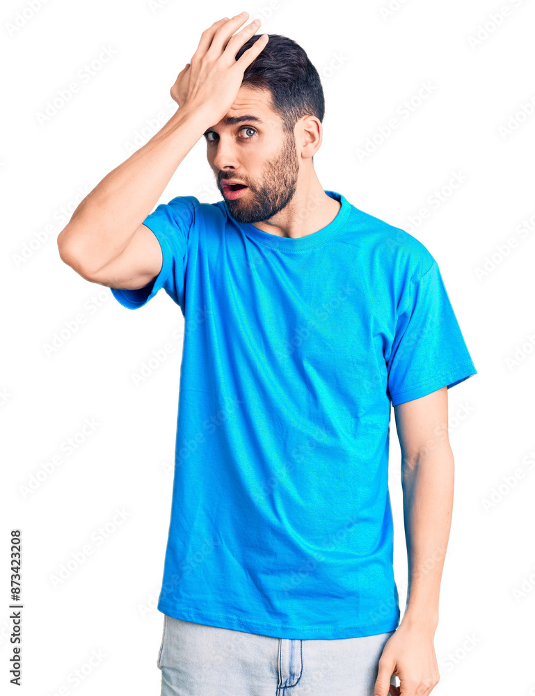 Young handsome man with beard wearing casual t-shirt surprised with hand on head for mistake, remember error. forgot, bad memory concept. Young handsome man with beard wearing casual t-shirt surprised with hand on head for mistake, remember error. forgot, bad memory concept.