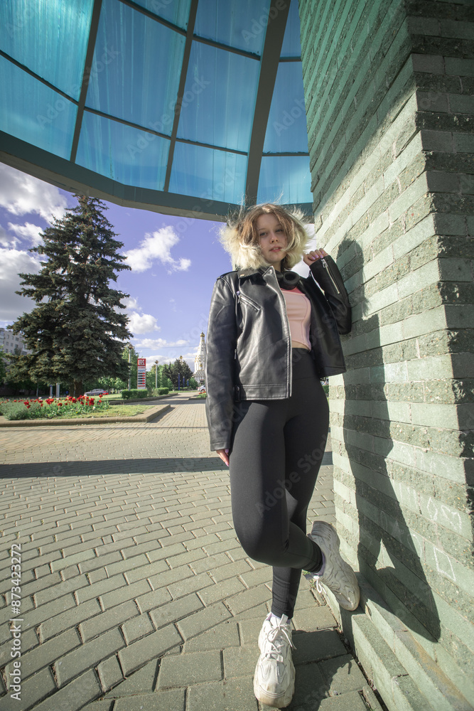 Portrait of a beautiful young beautiful girl in an urban environment. Portrait of a beautiful young beautiful girl in an urban environment.