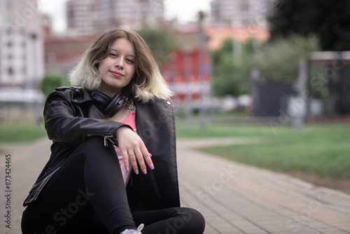 Portrait of a beautiful young beautiful girl in an urban environment.