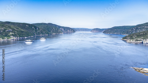 Aerial view of Saguenay Fjord taken by drone over the St-Lawrence river. View of the Baie-Ste-Catherine, Tadoussac ferry. photo