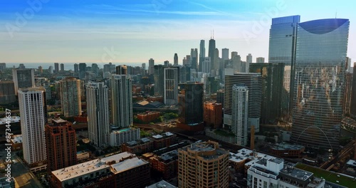 Wallpaper Mural Flight above the downtown of Chicago, Illinois, the USA at sunset. Hazy view of skyscrapers at night. Torontodigital.ca