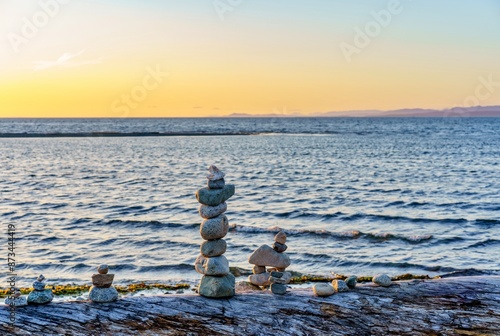 Stacking stones at beach in Parksville, BC, Canada 