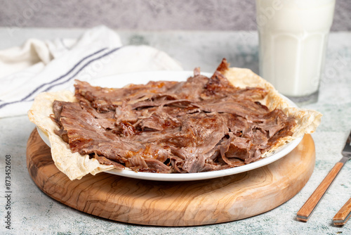Meat Doner. Traditional Turkish cuisine taste. Cooked meat doner kebab on gray background. local name et doner