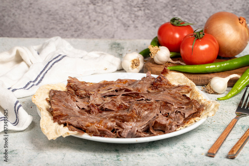 Meat Doner. Traditional Turkish cuisine taste. Cooked meat doner kebab on gray background. local name et doner. Close up