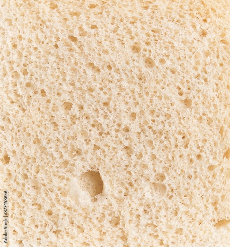 Obraz na plátne Close-up texture of fresh white bread with visible porous crumb structure, embodying the concept of bakery and nutrition