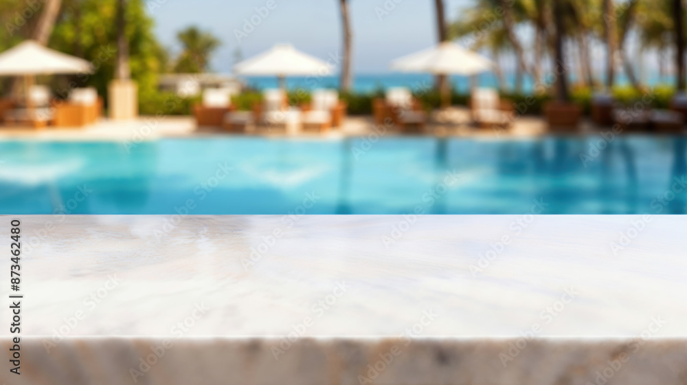 White marble surface providing space for products and tropical resort swimming pool in the background White marble surface providing space for products and tropical resort swimming pool in the background