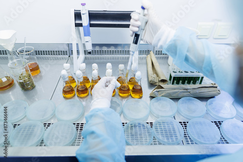 Obraz na plátně female laboratory assistant conducts research, chemical analysis, analysis of ba