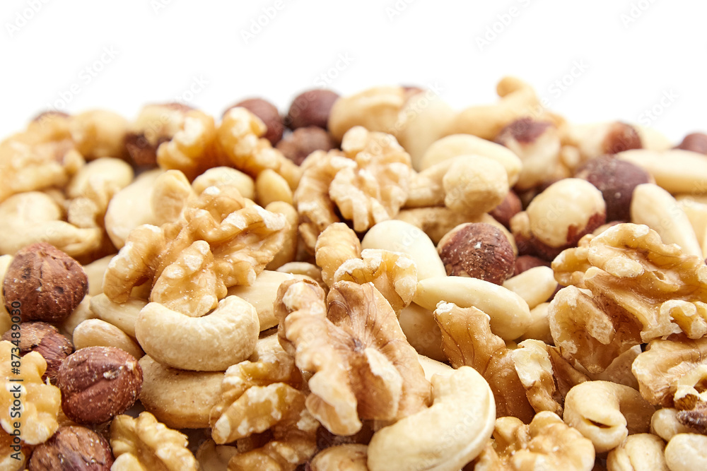 Close-up image of a mixed nuts assortment featuring walnuts, cashews, hazelnuts, and other varieties. The natural colors and textures highlight their freshness and nutritional value Close-up image of a mixed nuts assortment featuring walnuts, cashews, hazelnuts, and other varieties. The natural colors and textures highlight their freshness and nutritional value