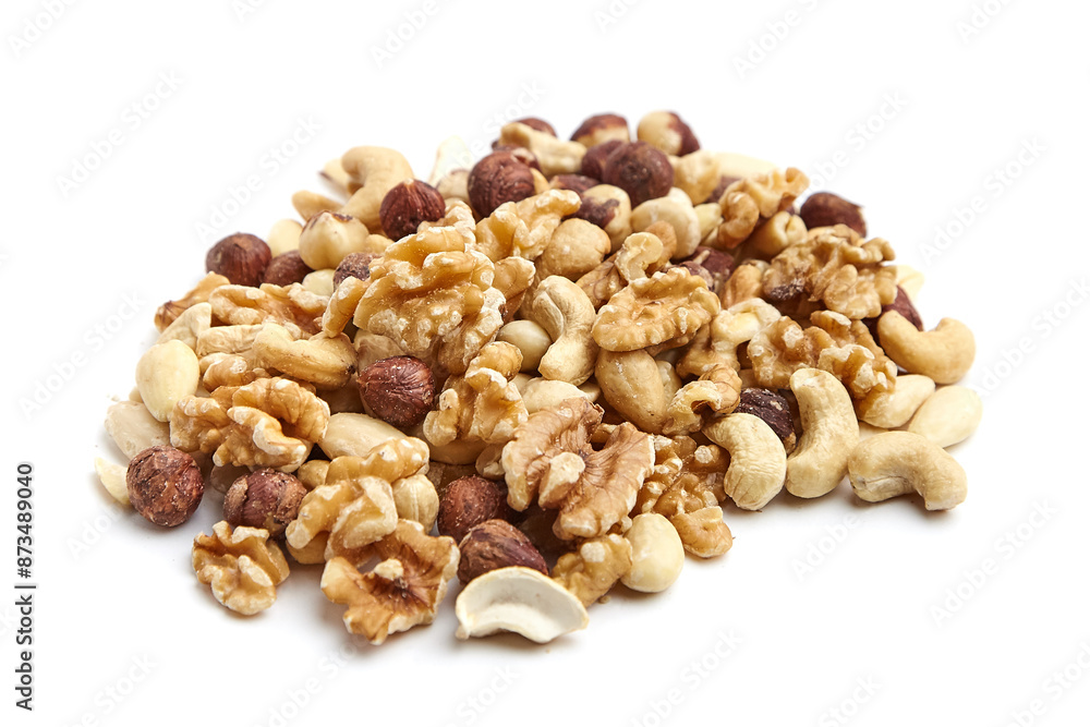 A pile of assorted mixed nuts, including walnuts, cashews, hazelnuts, and almonds, isolated on a white background A pile of assorted mixed nuts, including walnuts, cashews, hazelnuts, and almonds, isolated on a white background