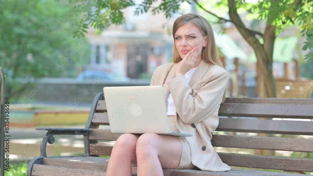 Businesswoman with Toothache Using Laptop Outdoor Businesswoman with Toothache Using Laptop Outdoor
