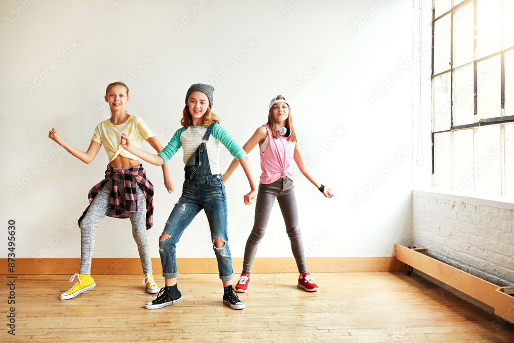 Fototapeta premium Dancing, girl group and portrait of kids with music, studio and rhythm for creative art performance or rehearsal. Teamwork, class and happy children in cool hip hop crew for practice or learning