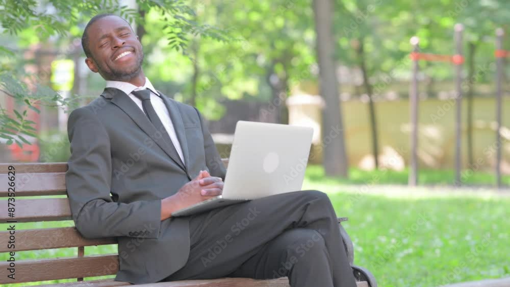 Smiling African Businessman with Laptop Looking at Camera Outdoor Smiling African Businessman with Laptop Looking at Camera Outdoor